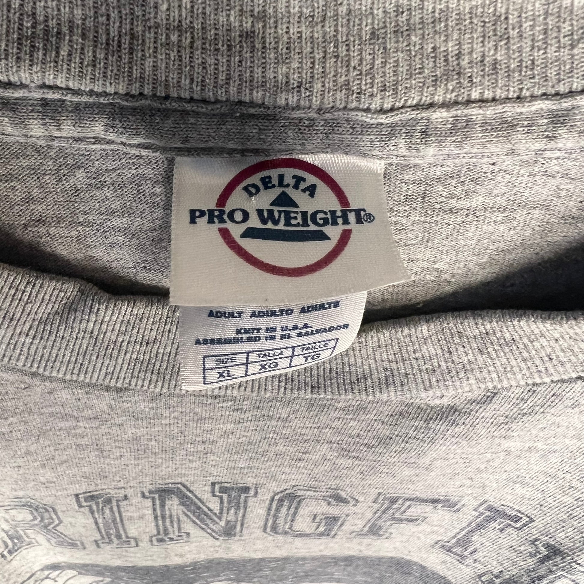 Delta Pro Weight neck tag close-up size XL assembled in El Salvador