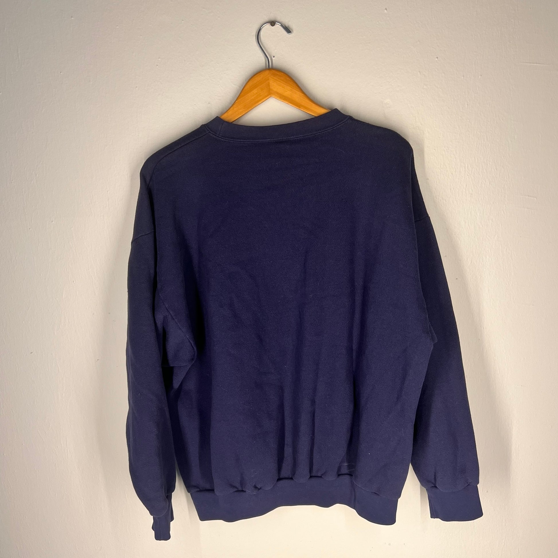 Back view of navy crewneck sweatshirt