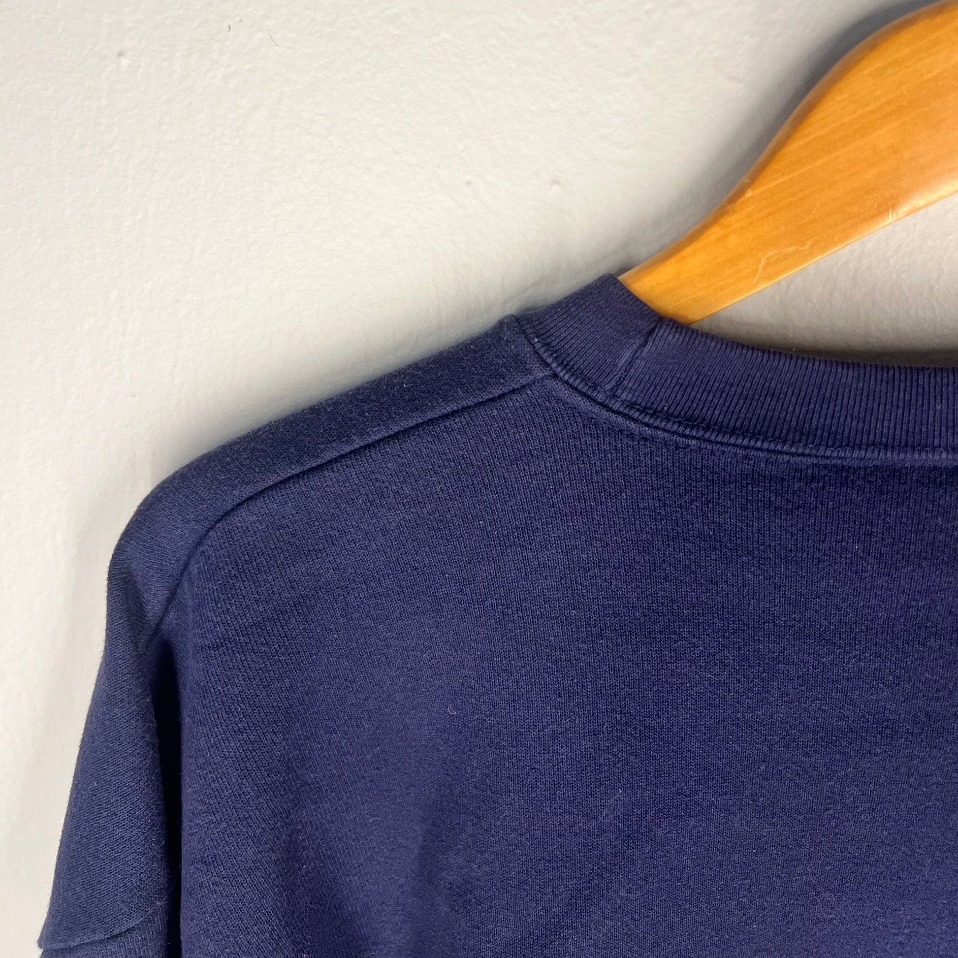 Close-up of shoulder seam construction and fabric texture