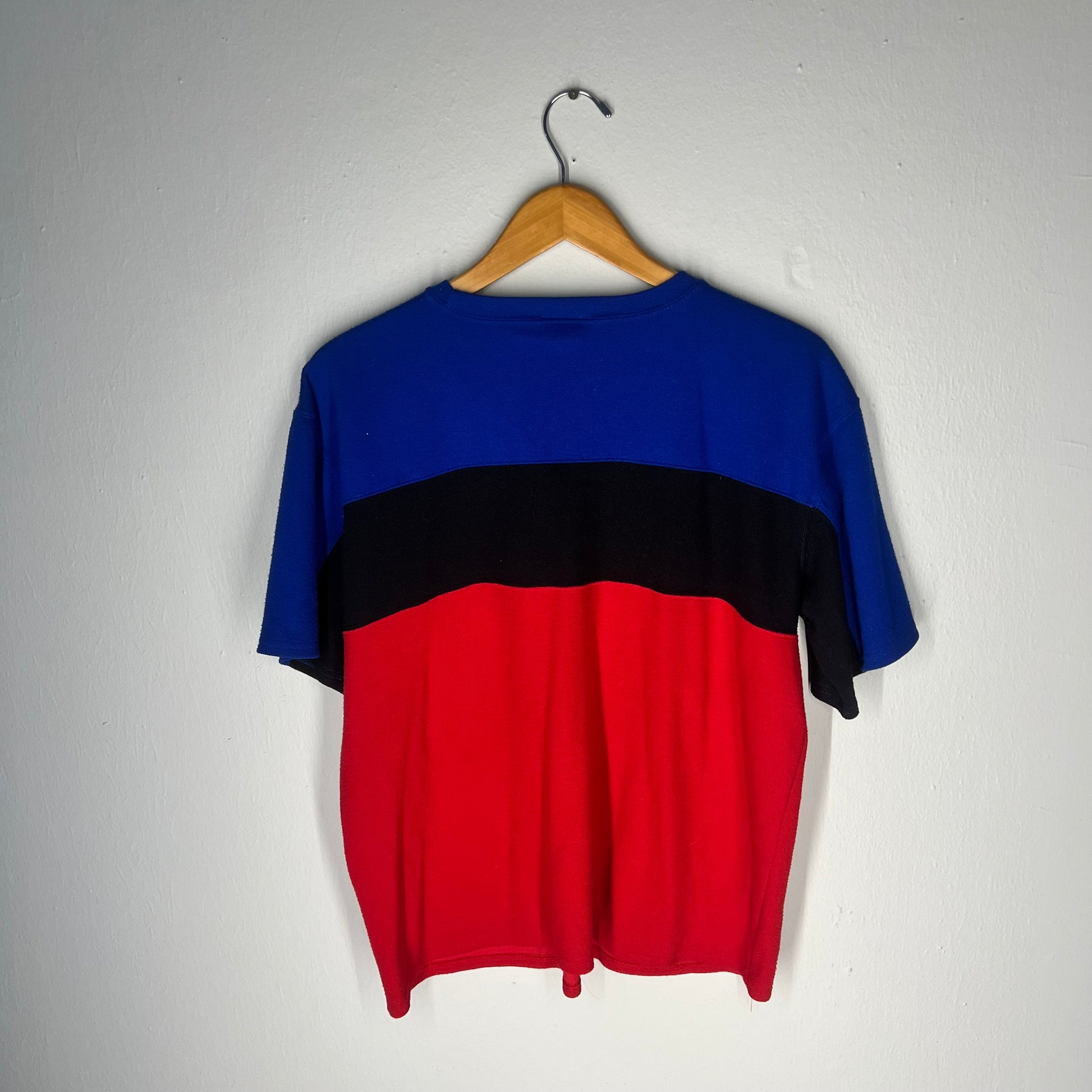 Back view of Tommy Hilfiger red, black, and blue colorblock t-shirt